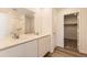 Bathroom featuring double sinks, quartz countertops, white cabinets, and a tiled shower/tub combination at 22015 E 39Th Ave, Aurora, CO 80019