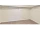 Spacious walk-in closet featuring neutral carpeting and ample storage, perfect for organizing and storing clothes at 22015 E 39Th Ave, Aurora, CO 80019