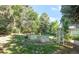 Landscaped backyard with garden beds and a charming trellis at 950 Everett St, Lakewood, CO 80215