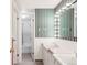 Charming bathroom featuring a double sink vanity, and a nearby shower, creating a functional space at 950 Everett St, Lakewood, CO 80215