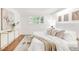 Bright bedroom with wood floors, large closets, and ample natural light at 950 Everett St, Lakewood, CO 80215