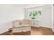 Comfortable Bedroom with a modern crib and wood floors at 950 Everett St, Lakewood, CO 80215