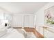 Bright bedroom with wood floors, large closets, and ample natural light at 950 Everett St, Lakewood, CO 80215