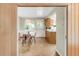 View of dining area and kitchen with warm, traditional decor and natural light at 950 Everett St, Lakewood, CO 80215