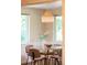 Dining nook with modern light fixture and view of well-manicured lawn at 950 Everett St, Lakewood, CO 80215