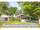 Charming mid-century home with lush landscaping and mature trees, offering a serene and private setting at 950 Everett St, Lakewood, CO 80215
