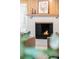 Close up on a cozy fireplace with burning fire and an eye-catching design at 950 Everett St, Lakewood, CO 80215