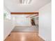 Spacious living room featuring hardwood floors and exposed wood beams adding architectural interest at 950 Everett St, Lakewood, CO 80215