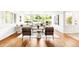 Bright and airy living room with hardwood floors and a large picture window with backyard views at 950 Everett St, Lakewood, CO 80215