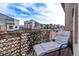 Relaxing balcony view with outdoor chaise lounge and view of community and street at 10031 Town Ridge Ln, Lone Tree, CO 80124