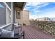 Balcony view with chairs, table, and privacy screen overlooking the community at 10031 Town Ridge Ln, Lone Tree, CO 80124