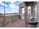 Private deck area with seating, offering views of the surrounding community and cityscape at 10031 Town Ridge Ln, Lone Tree, CO 80124