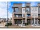 Modern townhome with a contemporary facade, private balconies, and a welcoming entrance at 10031 Town Ridge Ln, Lone Tree, CO 80124