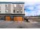 Exterior shot of the two-story house featuring a two-car garage and a well-maintained landscape at 10031 Town Ridge Ln, Lone Tree, CO 80124