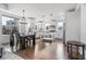 Bright, open kitchen with white cabinetry, stainless appliances, and a large island for dining and prep at 10031 Town Ridge Ln, Lone Tree, CO 80124