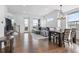 Open-concept living and dining area with modern furnishings and plenty of natural light at 10031 Town Ridge Ln, Lone Tree, CO 80124