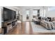Living area featuring hardwood floors, a comfortable sofa, and a staircase to upper level at 10031 Town Ridge Ln, Lone Tree, CO 80124