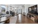 Open concept living space with modern furnishings, connecting kitchen, dining and living areas at 10031 Town Ridge Ln, Lone Tree, CO 80124