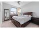Spacious main bedroom with walk-in closet, ceiling fan, and contemporary design at 10031 Town Ridge Ln, Lone Tree, CO 80124