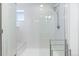 Bright bathroom shower with bench, subway tile surround, and glass doors at 10031 Town Ridge Ln, Lone Tree, CO 80124