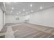 Spacious basement featuring carpet and recessed lighting, offering versatility for various uses at 8250 Snake River St, Littleton, CO 80125