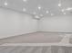Large, bright basement with plush carpet and ample space for recreation and relaxation at 8250 Snake River St, Littleton, CO 80125