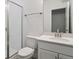 Elegant bathroom featuring a glass-enclosed shower, modern vanity, and stylish fixtures at 8250 Snake River St, Littleton, CO 80125