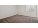 Cozy bedroom with soft carpeting and a bright window, perfect for rest and relaxation at 8250 Snake River St, Littleton, CO 80125