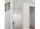 Bright hallway with view of staircase and neutral tones to allow easy customization at 8250 Snake River St, Littleton, CO 80125