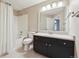 Bathroom featuring a shower-tub combo, commode and vanity at 3262 E 103Rd Dr # 1806, Thornton, CO 80229