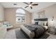 Vaulted ceiling bedroom with a large window and ceiling fan at 3262 E 103Rd Dr # 1806, Thornton, CO 80229