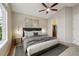 Bedroom with a ceiling fan and walk-in closet at 3262 E 103Rd Dr # 1806, Thornton, CO 80229