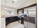 Well-equipped kitchen with stainless steel appliances, ample counter space and dark cabinetry at 3262 E 103Rd Dr # 1806, Thornton, CO 80229