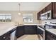 Modern kitchen with stainless steel appliances, and views from windows above the sink at 3262 E 103Rd Dr # 1806, Thornton, CO 80229
