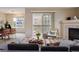 Comfortable living space featuring fireplace, dining area and outdoor access to the balcony at 3262 E 103Rd Dr # 1806, Thornton, CO 80229