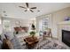 Comfortable living space featuring fireplace, dining area and outdoor access to the balcony at 3262 E 103Rd Dr # 1806, Thornton, CO 80229