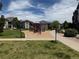 Neighborhood playground with various features on a mulch base at 3262 E 103Rd Dr # 1806, Thornton, CO 80229