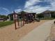 Well-maintained community playground with climbing and slide structures on a mulch base at 3262 E 103Rd Dr # 1806, Thornton, CO 80229