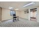 The finished basement includes carpet, a window, and a storage area at 4858 S Queen St, Littleton, CO 80127