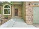 Inviting front entrance showcasing brick accents, a secure front door, and a well-kept walkway at 4858 S Queen St, Littleton, CO 80127