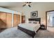 Main bedroom with closet and ensuite bathroom with shower, providing comfort and convenience at 4858 S Queen St, Littleton, CO 80127