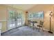 Cozy sun room featuring natural light, carpet, and a great view of the outdoors at 4858 S Queen St, Littleton, CO 80127