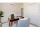 Bright office with a modern desk, comfortable seating, and built in closet space for ample storage at 1390 S Jasmine Way, Denver, CO 80224