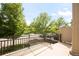 Relax on this condo balcony overlooking the parking lot and mature landscaping at 9369 Longs Peak Dr, Commerce City, CO 80640