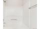 Bright bathroom featuring a white shower and silver fixtures at 9369 Longs Peak Dr, Commerce City, CO 80640