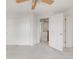 Bedroom featuring sliding closet doors and easy access to the hallway at 9369 Longs Peak Dr, Commerce City, CO 80640