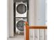 Conveniently located laundry area featuring stacked washer and dryer at 9369 Longs Peak Dr, Commerce City, CO 80640