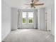 Spacious main bedroom with neutral walls, large windows, and a ceiling fan with a light fixture at 9369 Longs Peak Dr, Commerce City, CO 80640