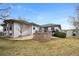 Well maintained backyard with a stone fire pit and deck, great for outdoor entertaining at 8155 W Tennessee Dr, Lakewood, CO 80226