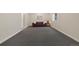 Basement living room featuring cozy sofa and carpet flooring at 8155 W Tennessee Dr, Lakewood, CO 80226